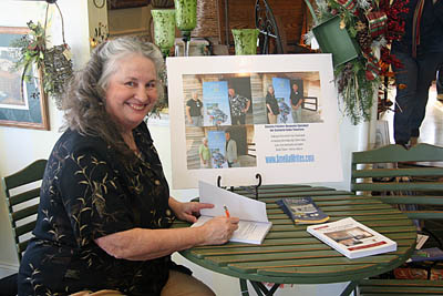 Author Amelia Painter signs her books at Annual event