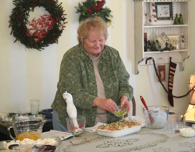 Donna Muilenburg giving cooking lesson at the 29th University of Okoboji Winter Games